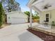 Backyard with a two-car garage, outdoor kitchen, and covered patio at 3101 Auburn Ave, Charlotte, NC 28209