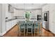 Modern kitchen with stainless steel appliances, granite countertops, and an island with seating for three people at 3101 Auburn Ave, Charlotte, NC 28209