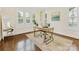 Bright home office with hardwood floors, a sleek desk, and multiple windows offering natural light at 3101 Auburn Ave, Charlotte, NC 28209