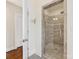 Shower featuring stylish glass doors and sleek gray tiling at 3101 Auburn Ave, Charlotte, NC 28209
