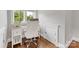 Bright workspace featuring a white desk, a rolling chair, and hardwood floors at 3101 Auburn Ave, Charlotte, NC 28209