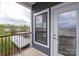 Cozy balcony, with a view of trees and a building at 3630 N Davidson St # 3301, Charlotte, NC 28205