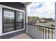 View from private balcony overlooking streetscape and greenery at 3630 N Davidson St # 3301, Charlotte, NC 28205
