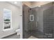 Modern bathroom with tiled shower, sleek fixtures, and ample natural light through the window at 3630 N Davidson St # 3301, Charlotte, NC 28205