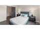 Comfortable bedroom with a modern design, featuring a sliding barn door to an adjacent walk-in closet at 3630 N Davidson St # 3301, Charlotte, NC 28205
