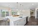 Kitchen and dining area featuring an island and dining table at 3630 N Davidson St # 3301, Charlotte, NC 28205