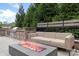 Relaxing patio area featuring an outdoor kitchen, comfortable seating, and a modern fire pit at 3630 N Davidson St # 3301, Charlotte, NC 28205