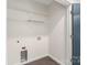 Empty walk-in closet featuring shelving and connections for washer/dryer installation at 3630 N Davidson St # 3301, Charlotte, NC 28205