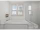 Well lit bathroom with a glass shower, and a built-in tub under a window at 376 Sensibility Cir # 8, Fort Mill, SC 29708