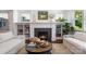 Close-up of a fireplace with built-in shelving and stylish decor in the well-lit living room at 376 Sensibility Cir # 8, Fort Mill, SC 29708