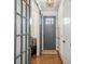 Welcoming foyer with hardwood floors, glass door, sliding door and modern light fixture at 376 Sensibility Cir # 8, Fort Mill, SC 29708