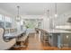 Open floor plan with hardwood floors combining a spacious kitchen, dining, and living area at 376 Sensibility Cir # 8, Fort Mill, SC 29708
