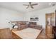 Cozy living room features a sectional sofa, a ceiling fan, and hardwood floors at 376 Sensibility Cir # 8, Fort Mill, SC 29708