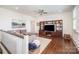 Spacious living room with a ceiling fan, built-in shelving, and hardwood floors at 376 Sensibility Cir # 8, Fort Mill, SC 29708