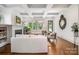 Bright and airy living room with coffered ceilings and large windows overlooking the lush outdoors at 376 Sensibility Cir # 8, Fort Mill, SC 29708