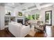 Cozy living room featuring a fireplace, built-in shelving, large windows, and comfortable seating arrangements at 376 Sensibility Cir # 8, Fort Mill, SC 29708