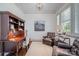 Comfortable office with natural light from shuttered window and hardwood floors at 376 Sensibility Cir # 8, Fort Mill, SC 29708