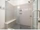 Contemporary shower with glass doors, built-in bench, and neutral-toned tiles for a spa-like experience at 376 Sensibility Cir # 8, Fort Mill, SC 29708