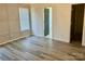 Neutral bedroom featuring modern trim, light-colored walls, and wood-look floors at 3776 Kennedy Rd, Gastonia, NC 28056
