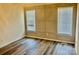 Bedroom with wall trim, neutral colors, wood-look floors, and natural light at 3776 Kennedy Rd, Gastonia, NC 28056