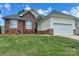 Charming brick and vinyl home with a well-manicured lawn and two-car garage at 3776 Kennedy Rd, Gastonia, NC 28056