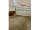 Garage with large door and brick accent wall at 3776 Kennedy Rd, Gastonia, NC 28056
