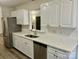 Modern kitchen featuring white cabinets, stainless steel appliances, and quartz countertops at 3776 Kennedy Rd, Gastonia, NC 28056