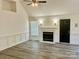Inviting living room with fireplace, wood-look floors, and white trim at 3776 Kennedy Rd, Gastonia, NC 28056