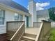 Spacious wooden deck with railings and stairs leading to the backyard at 3776 Kennedy Rd, Gastonia, NC 28056