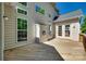 Spacious wooden back deck with a light-colored siding and lush surrounding trees at 397 Fischer Rd, Fort Mill, SC 29715