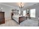 Comfortable bedroom with natural light, a decorative chandelier, and neutral decor at 397 Fischer Rd, Fort Mill, SC 29715