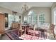 Sunlit dining room with bright windows, classic chandelier, and decor at 397 Fischer Rd, Fort Mill, SC 29715