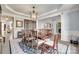Spacious dining room featuring a long wooden table, china cabinet, and ample seating at 397 Fischer Rd, Fort Mill, SC 29715