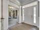 Bright foyer with hardwood floors, white trim, and a glimpse into a cozy living space at 397 Fischer Rd, Fort Mill, SC 29715