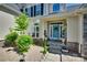 Inviting front door with a blue finish and decorative wreath, framed by elegant landscaping at 397 Fischer Rd, Fort Mill, SC 29715