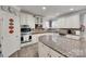 Well-equipped kitchen featuring granite countertops, stainless steel appliances, and custom cabinetry at 397 Fischer Rd, Fort Mill, SC 29715