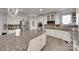 Modern kitchen featuring a large island, custom cabinets, and a stainless steel refrigerator at 397 Fischer Rd, Fort Mill, SC 29715