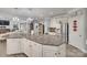 Open kitchen with a spacious island, stainless steel refrigerator, and access to living spaces at 397 Fischer Rd, Fort Mill, SC 29715