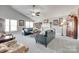 Inviting living room with vaulted ceilings, a ceiling fan, and cozy seating arrangements at 397 Fischer Rd, Fort Mill, SC 29715