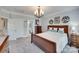 This main bedroom features a chandelier, accent wall decorations, and decorative furniture at 397 Fischer Rd, Fort Mill, SC 29715