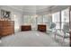Bright sitting area featuring multiple windows, carpet floors and classic wood furnishings at 397 Fischer Rd, Fort Mill, SC 29715