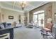Comfortable sitting room featuring a chandelier, coffered ceiling, and ample natural light at 397 Fischer Rd, Fort Mill, SC 29715