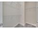 Empty walk-in closet with ample shelving and neutral carpeting at 397 Fischer Rd, Fort Mill, SC 29715