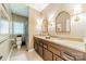 This bathroom features a double vanity with granite countertops and large arched mirrors at 4033 Weddington Manor Ct, Matthews, NC 28104