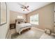 This bedroom features a ceiling fan, a neutral color palette, and lots of natural light at 4033 Weddington Manor Ct, Matthews, NC 28104