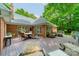 Spacious outdoor deck featuring multiple seating areas and a grill, perfect for entertaining or relaxing in style at 4033 Weddington Manor Ct, Matthews, NC 28104