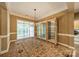 Dining room featuring large windows, decorative lighting, and ample space at 4033 Weddington Manor Ct, Matthews, NC 28104