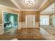 Elegant foyer with hardwood floors, classic molding, and abundant natural light at 4033 Weddington Manor Ct, Matthews, NC 28104