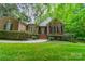 Charming brick home featuring a beautifully landscaped yard, walkway, and classic architectural details at 4033 Weddington Manor Ct, Matthews, NC 28104