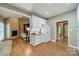 Open-concept kitchen with white cabinets and a seamless transition to the living area at 4033 Weddington Manor Ct, Matthews, NC 28104